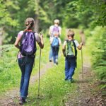 A family hiking through the forest