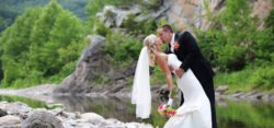 A groom and bride kissing.