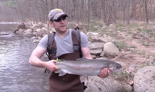 fisherman holding a large fish